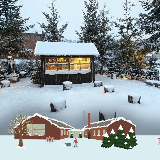 Julehytten i Juleskoven dækket i sne.