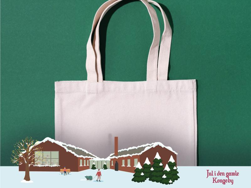 Hvid mulepose på grøn baggrund. Jul i den gamle Kongeby logo.