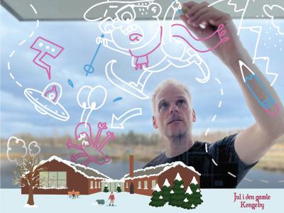 Peter Hermann står og tegner sjove illustrationer.